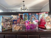 Overall lot with boxed Barbies, Aristocats set, beanie babies, Hawaiian dolls, stuffed animals