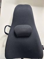 Front view of black ObusForme backrest support showing removable lumbar pad