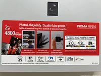 Top view showing model sticker and feature list of Canon PIXMA MP250