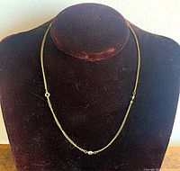 Necklace displayed on bust showing full length and crystal placement