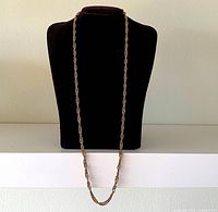 Full view of necklace on bust showing length and rope design