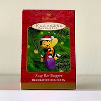 Front view of Hallmark Keepsake "Busy Bee Shopper" ornament box