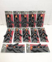 All twelve HOME brand 2-packs of plastic spring clamps displayed front on