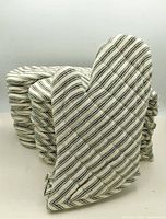 Front view of striped cotton oven mitt with stack behind
