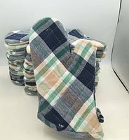 Front view of plaid oven mitt showing pattern and quilting