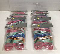 Eight sealed packs of Spritz Novelty Eyewear arranged in two columns