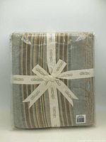Front view of packaged Alkaso striped cotton throw blanket