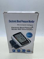 Front of boxed electronic blood pressure monitor