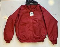 Front view of red Tri-Mountain fleece-lined jacket