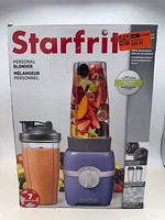 Front of retail box showing blender, cup and base