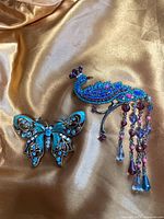 Front view showing both brooches together