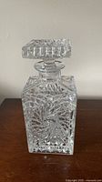 Square crystal decanter with pinwheel pattern front view
