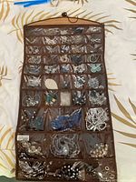 Full view of jewelry hanger loaded with assorted jewelry