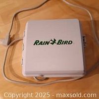 Closed Rain Bird SST-1200 controller with power cord