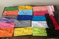 All 21 headbands arranged on table showing colour variety