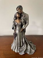 Full view of bride and groom sculpture front