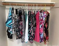 All garments hanging on closet rod showing variety and quantity