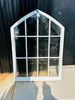 front view of arched 12-pane window