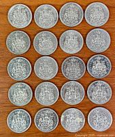 All 20 coins laid out obverse down showing reverse design