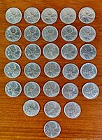 Full layout of all coins on wooden surface