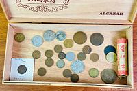 Overview of all coins, roll and cigar box