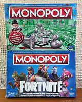 Front view of both sealed Monopoly games