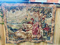 Full view of tapestry hung outdoors