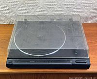 Overall view of Toshiba SR-5617 turntable with dust cover