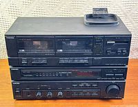 Front view of stacked Toshiba cassette deck, tuner and amplifier