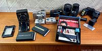 Group shot of all cameras, lenses, holders and boxed pocket set