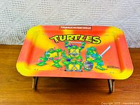 Full view of tray on legs showing graphics and condition