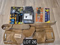 All items laid out together showing tool belts, nozzle kit, epoxy, WD-40