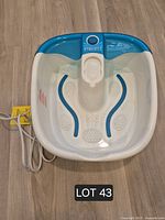 Top view of HoMedics electric foot bath showing branding, basin and power cord