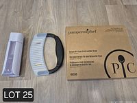 Oil spritzer, crinkle cutter, and boxed fruit leather trays on floor