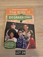 Front of slipcase showing series title and cast photo