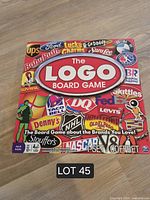 Front of game box displaying title and brand logo collage