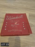 Front view of red Rummoli De Luxe box