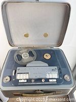 Overall view of Grundig TK 45 recorder in open carry case with clear reel