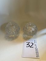 Pair of textured clear glass snowball-style candle holders front view