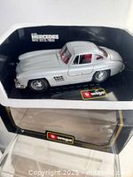 Model car inside Styrofoam display showing exterior