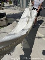 Full view of hammock being held showing length and fabric