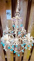 Front view showing full chandelier, drops, birds, sockets