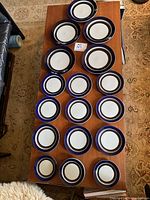 All 18 plates laid out on table