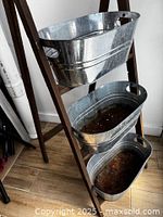 front view showing stand and three tubs