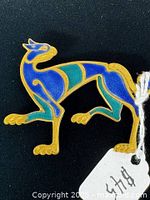 Front view of brooch showing full design and colors