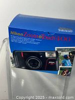 Retail box for Nikon Zoom Touch 400 showing product image and specifications