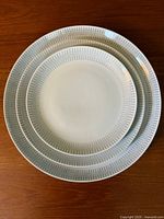 Stacked view showing three plate sizes with pattern