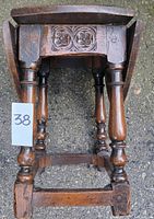 Underside view showing carved apron, turned legs and stretchers