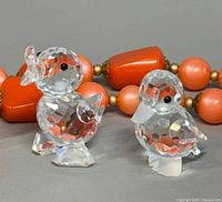 Both Swarovski crystal duck figurines front view