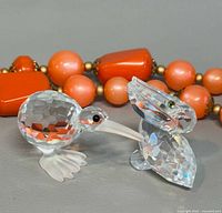 Kiwi bird and pelican crystal figurines front view